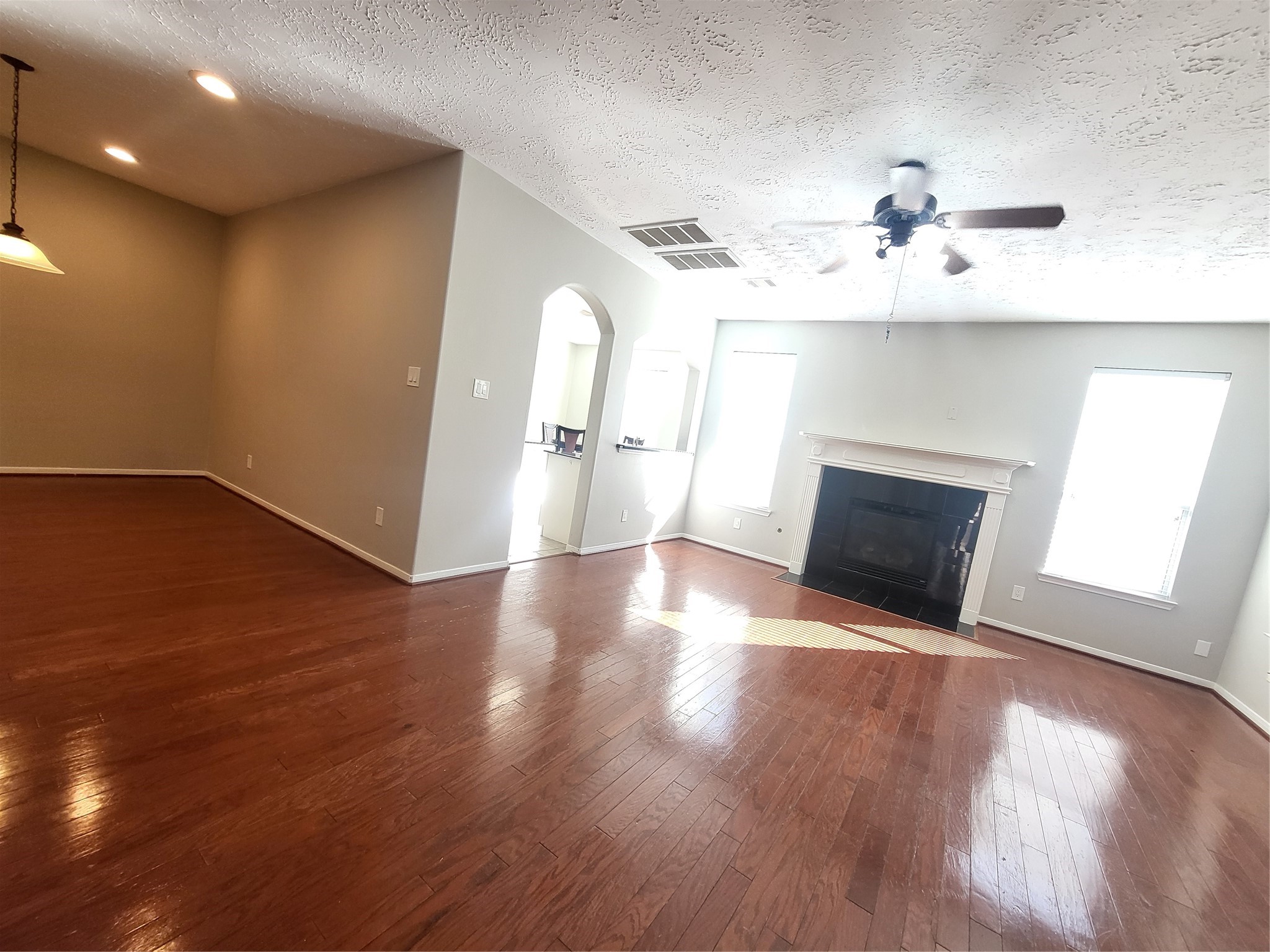 7415 Hollister Ridge Houston, TX 77040 - Photo 5 of 36 a view of a room with wooden floors and fireplace