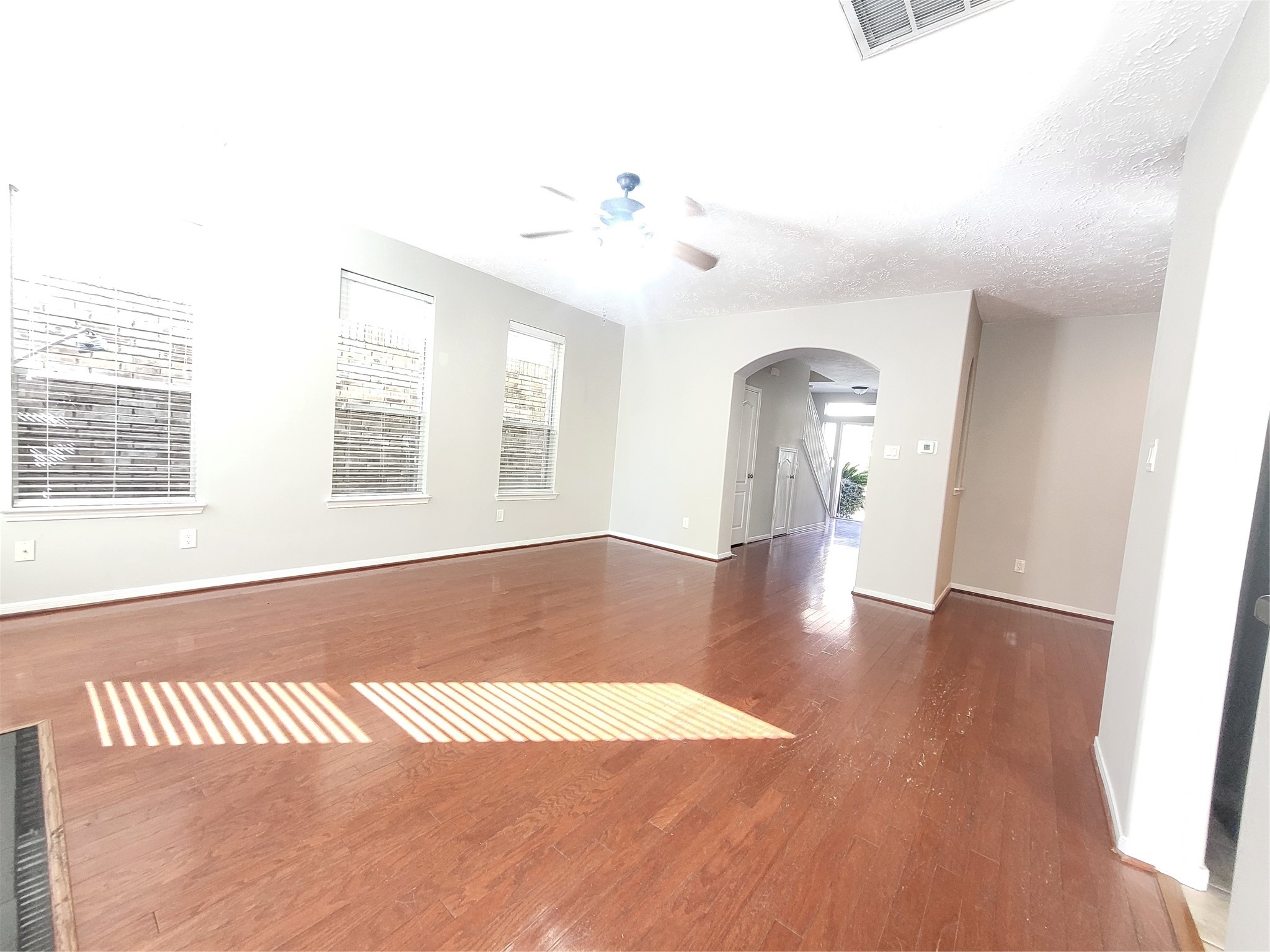 7415 Hollister Ridge Houston, TX 77040 - Photo 7 of 36 a view of a room with wooden floor and window