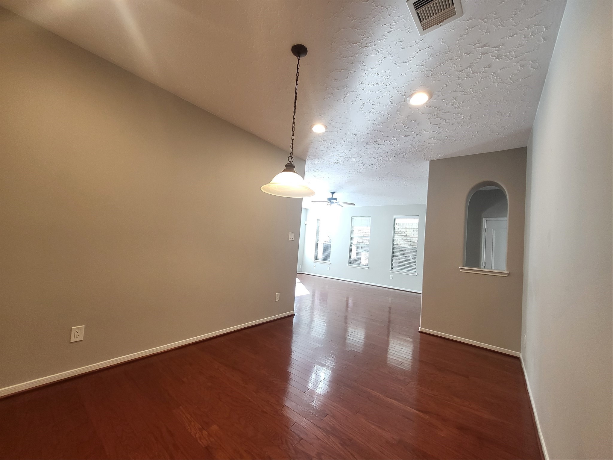 7415 Hollister Ridge Houston, TX 77040 - Photo 8 of 36 a view of empty room with wooden floor and fan