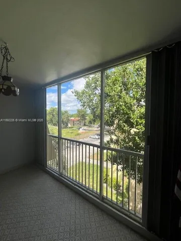 a view of a room with large windows