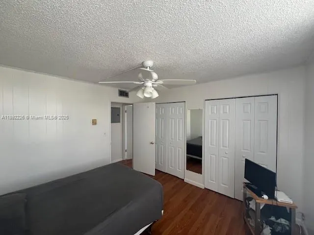 wooden floor in an empty room with a fireplace