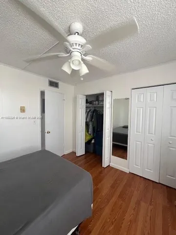 a view of a livingroom with a chandelier fan