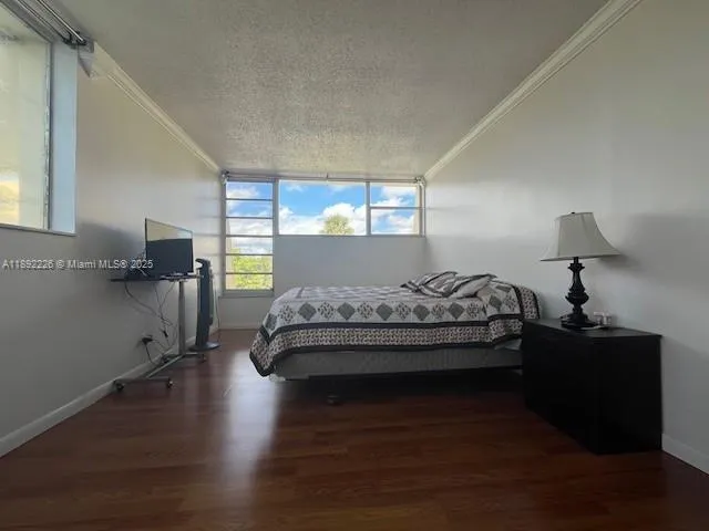 a bedroom with bed and window