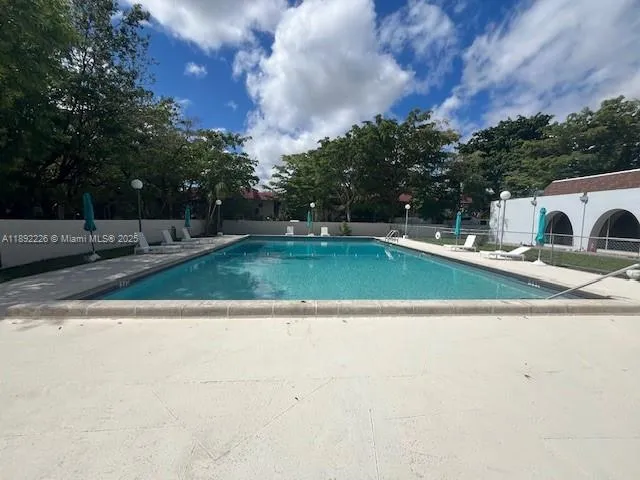 a view of a playground with basketball court
