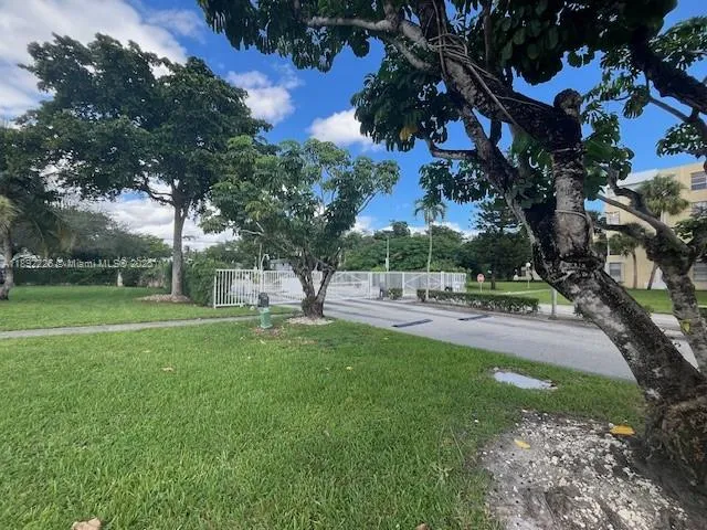 a view of backyard with green space