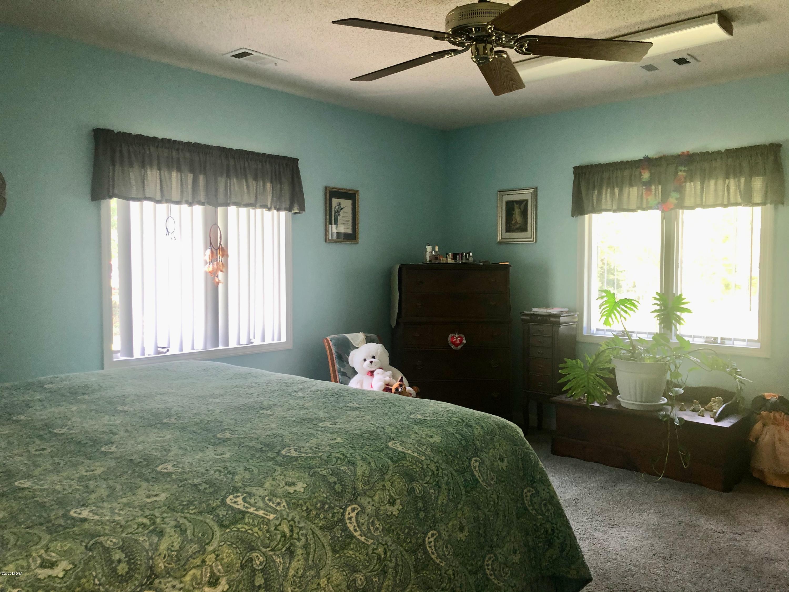 2136 Walton Road Fort Valley, GA 31030 - Photo 14 of 58 a bedroom with bed and window