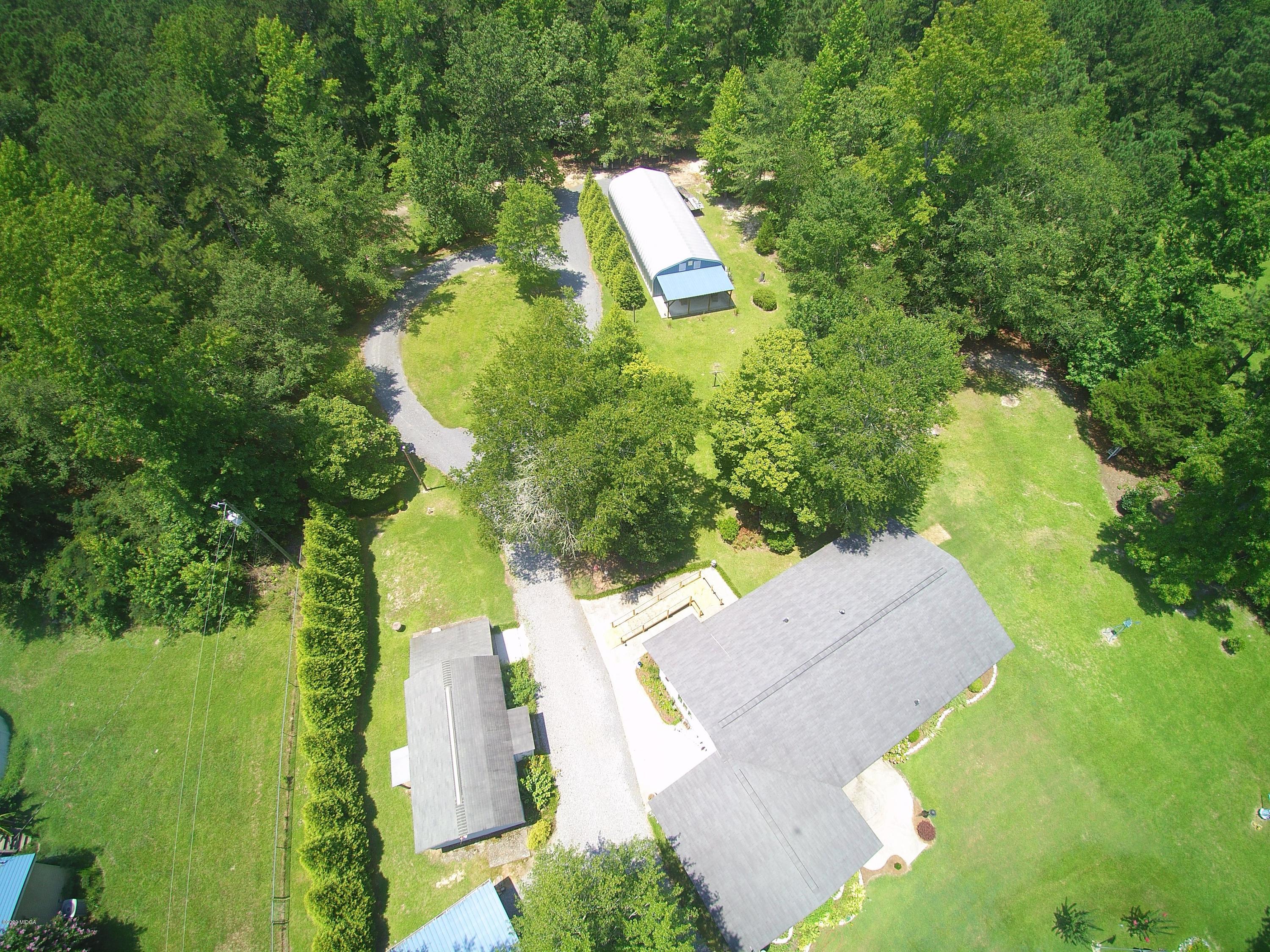2136 Walton Road Fort Valley, GA 31030 - Photo 50 of 58 an aerial view of residential house with outdoor space and trees all around