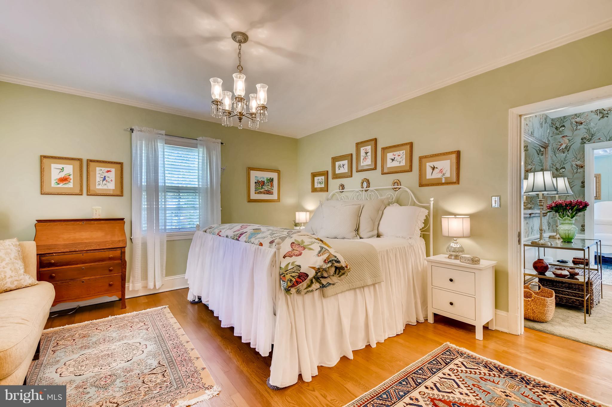 5302 Springlake Way Baltimore, MD 21212 - Photo 16 of 35 a spacious bedroom with a bed and wooden floor