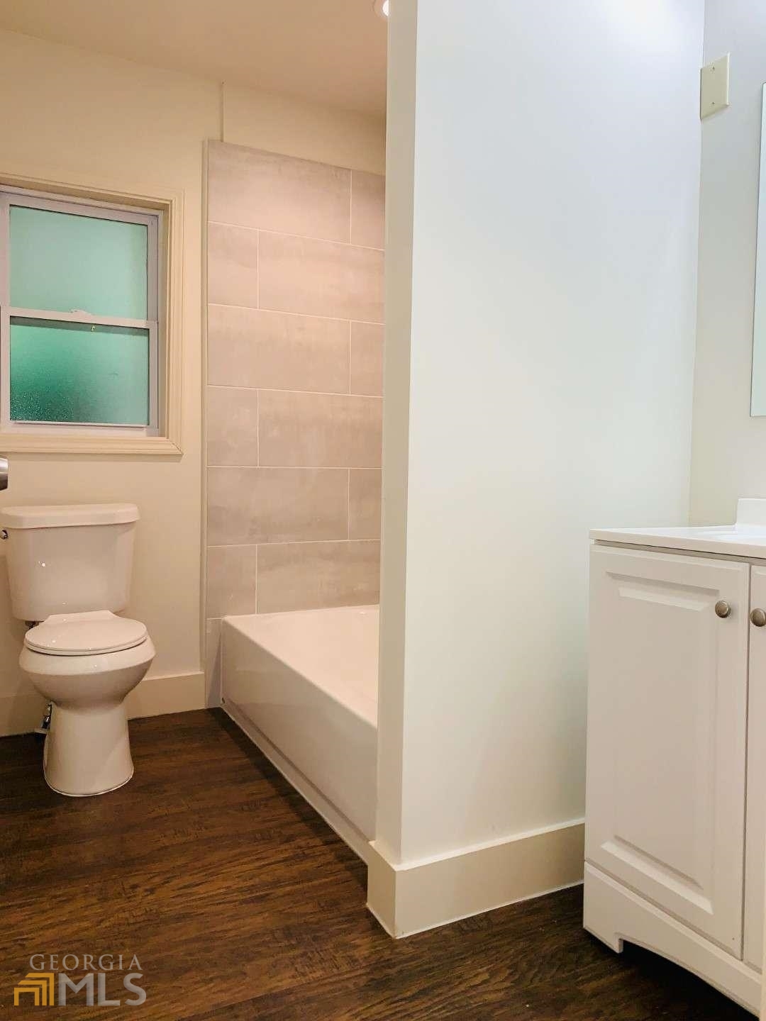 364 Brooks Avenue Southwest Atlanta, GA 30310 - Photo 9 of 21 a bathroom with a toilet and a shower