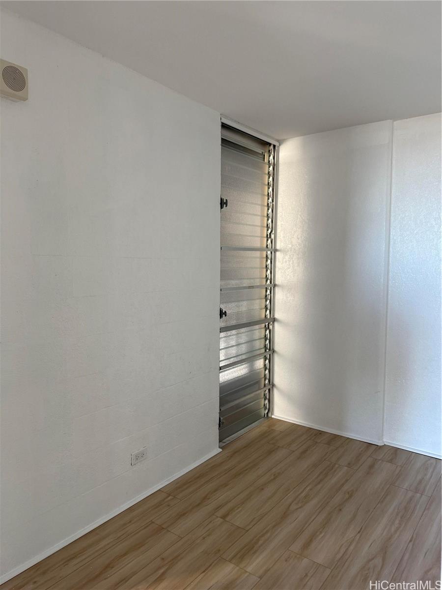 1226 Alexander Street, Unit 505 Honolulu, HI 96826 - Photo 1 of 24 a view of empty room with wooden floor