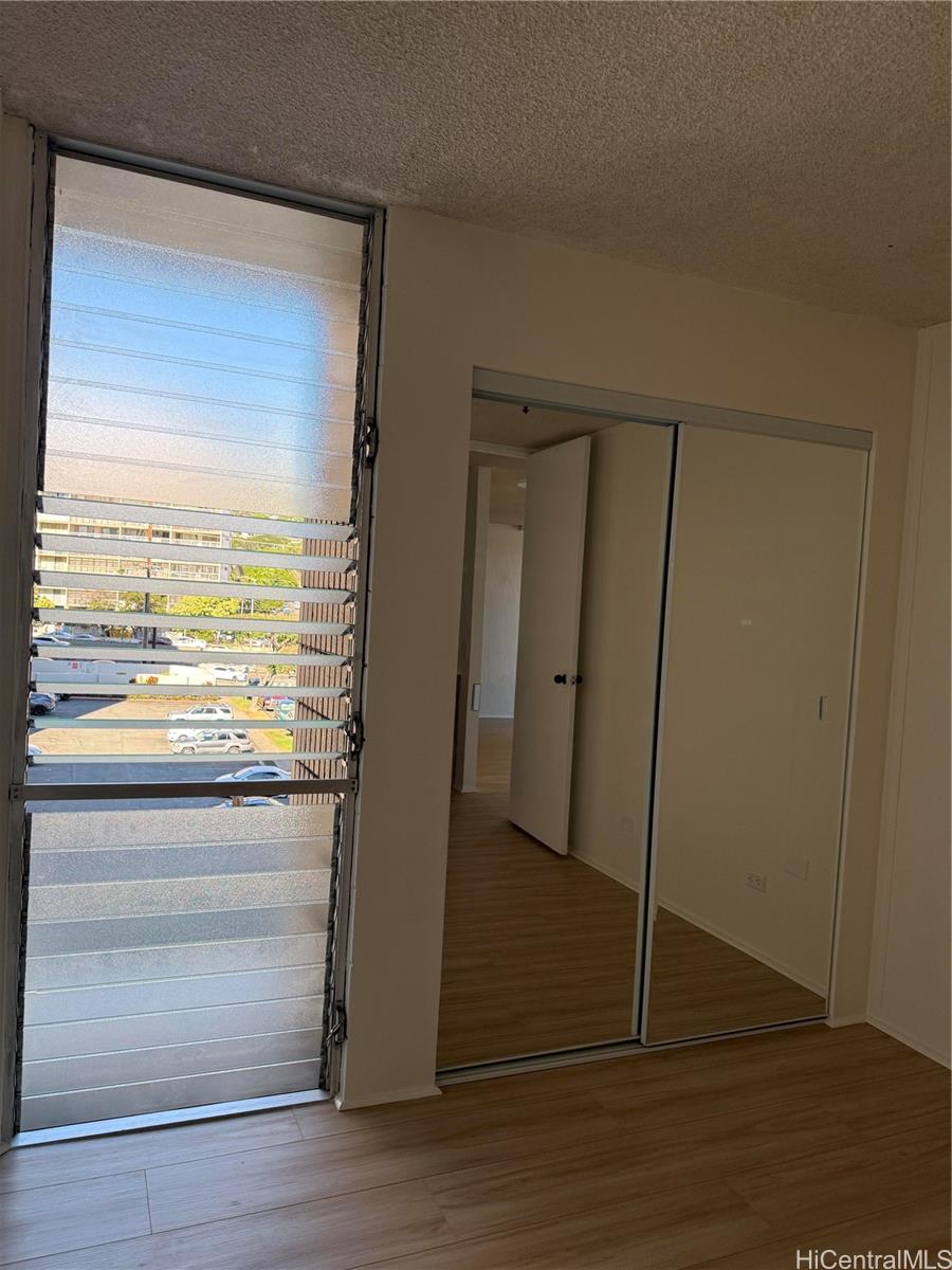 1226 Alexander Street, Unit 505 Honolulu, HI 96826 - Photo 17 of 24 a view of walk in closet with hardwood floor