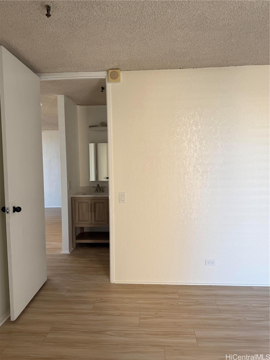 1226 Alexander Street, Unit 505 Honolulu, HI 96826 - Photo 20 of 24 a view of a room with wooden floor and a sink