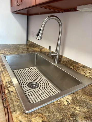 a white refrigerator freezer and a stove sitting inside of a kitchen
