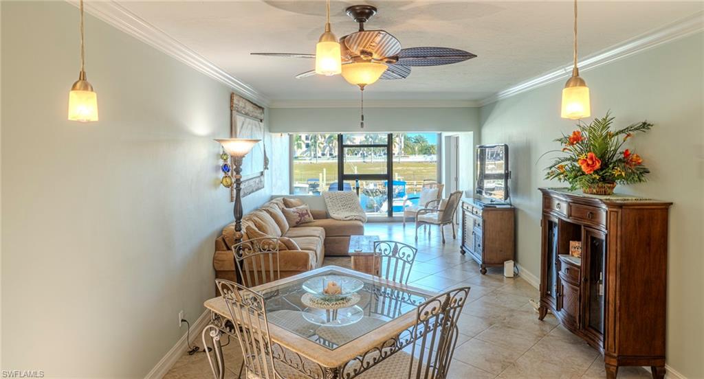 803 River Point Drive, Unit 105B Naples, FL 34102 - Photo 14 of 36 a view of a dining room with furniture window and outside view