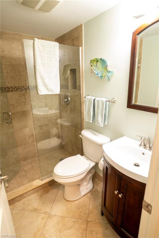 803 River Point Drive, Unit 105B Naples, FL 34102 - Photo 27 of 36 a bathroom with a sink toilet and shower
