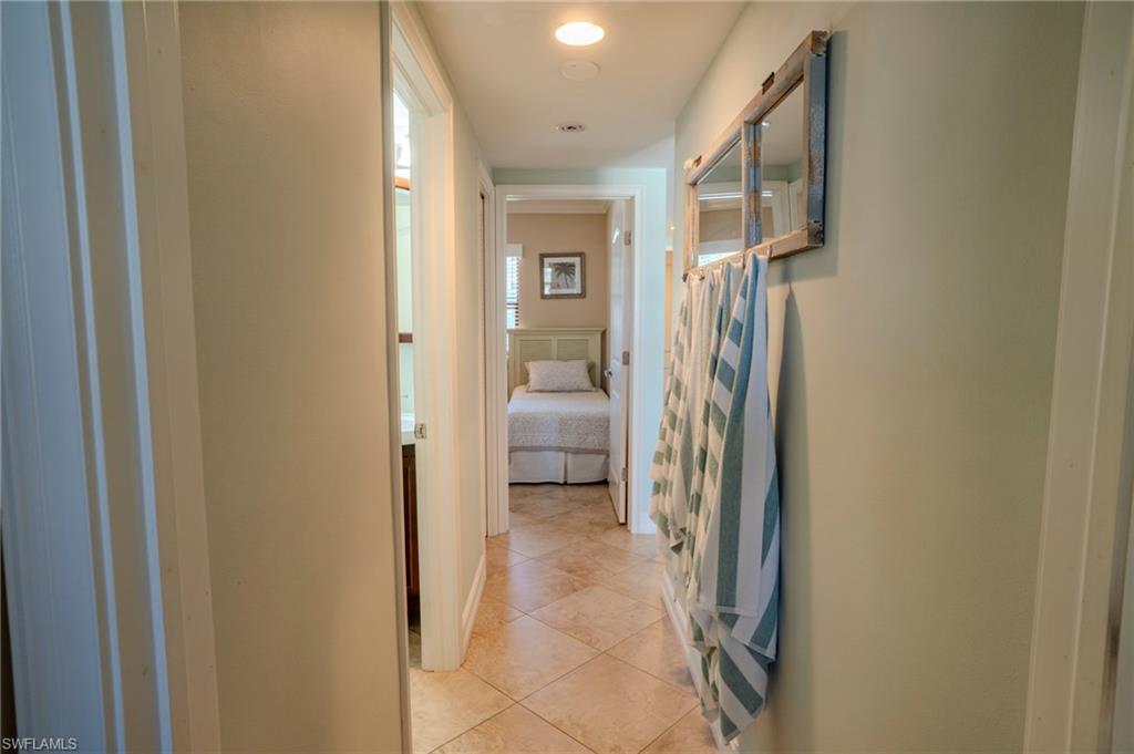 803 River Point Drive, Unit 105B Naples, FL 34102 - Photo 29 of 36 a view of a hallway with walk in closet