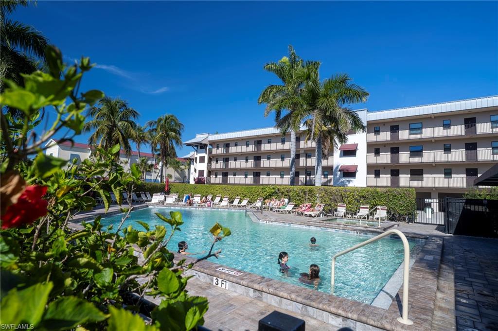 803 River Point Drive, Unit 105B Naples, FL 34102 - Photo 35 of 36 a sign that is sitting in front of a building