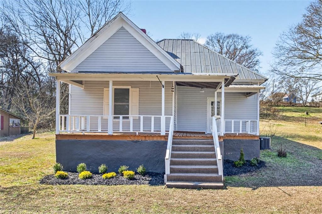 front view of a house with a yard