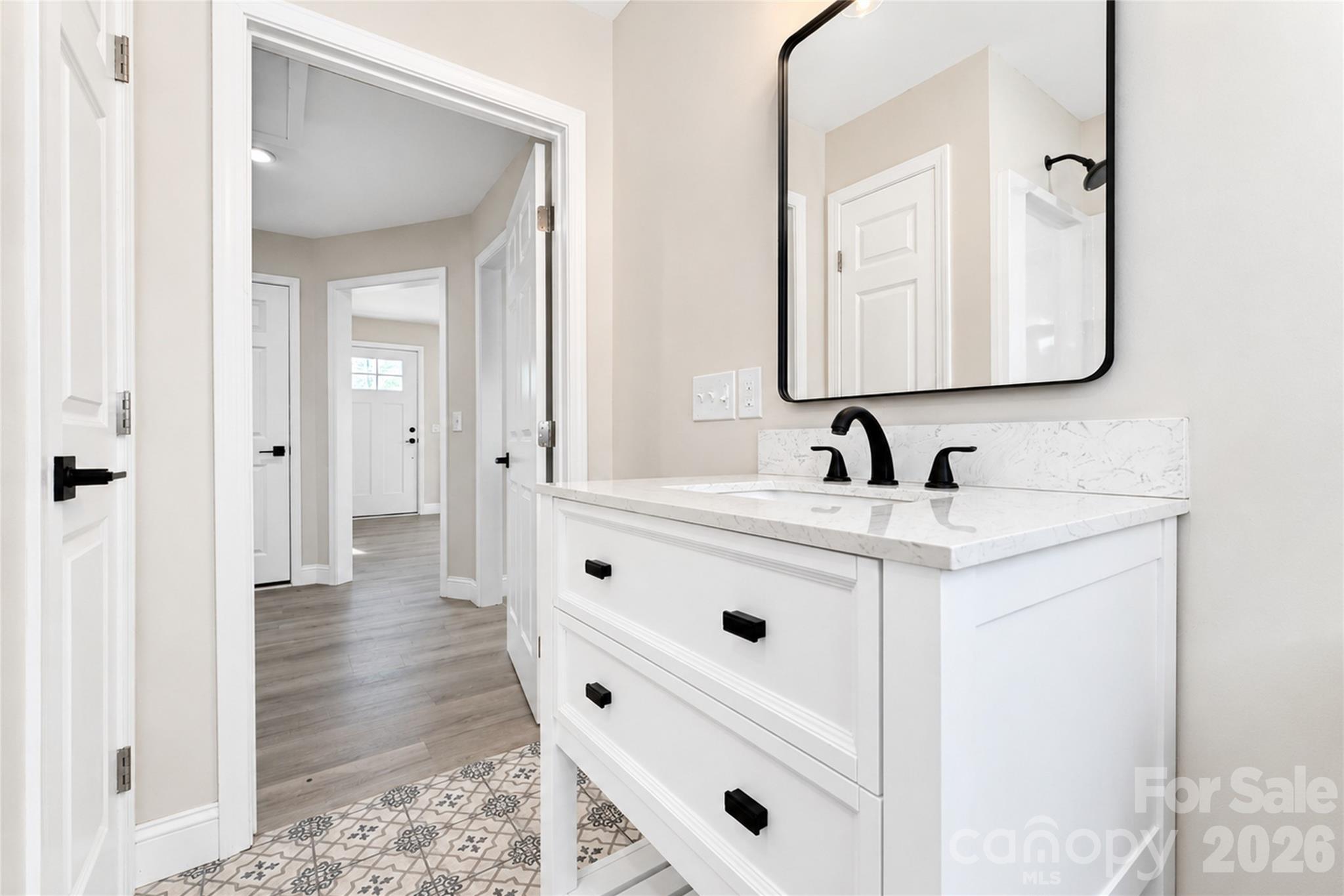 1403 Dudley Shoals Road Granite Falls, NC 28630 - Photo 15 of 34 a bathroom with a sink vanity and mirror