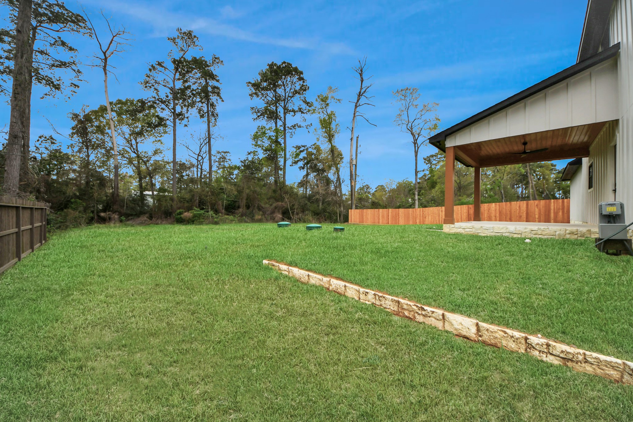 29727 Spring Forest Drive Spring, TX 77386 - Photo 34 of 37 Expansive backyard offering plenty of open green space—perfect for outdoor entertaining, pets, and play.