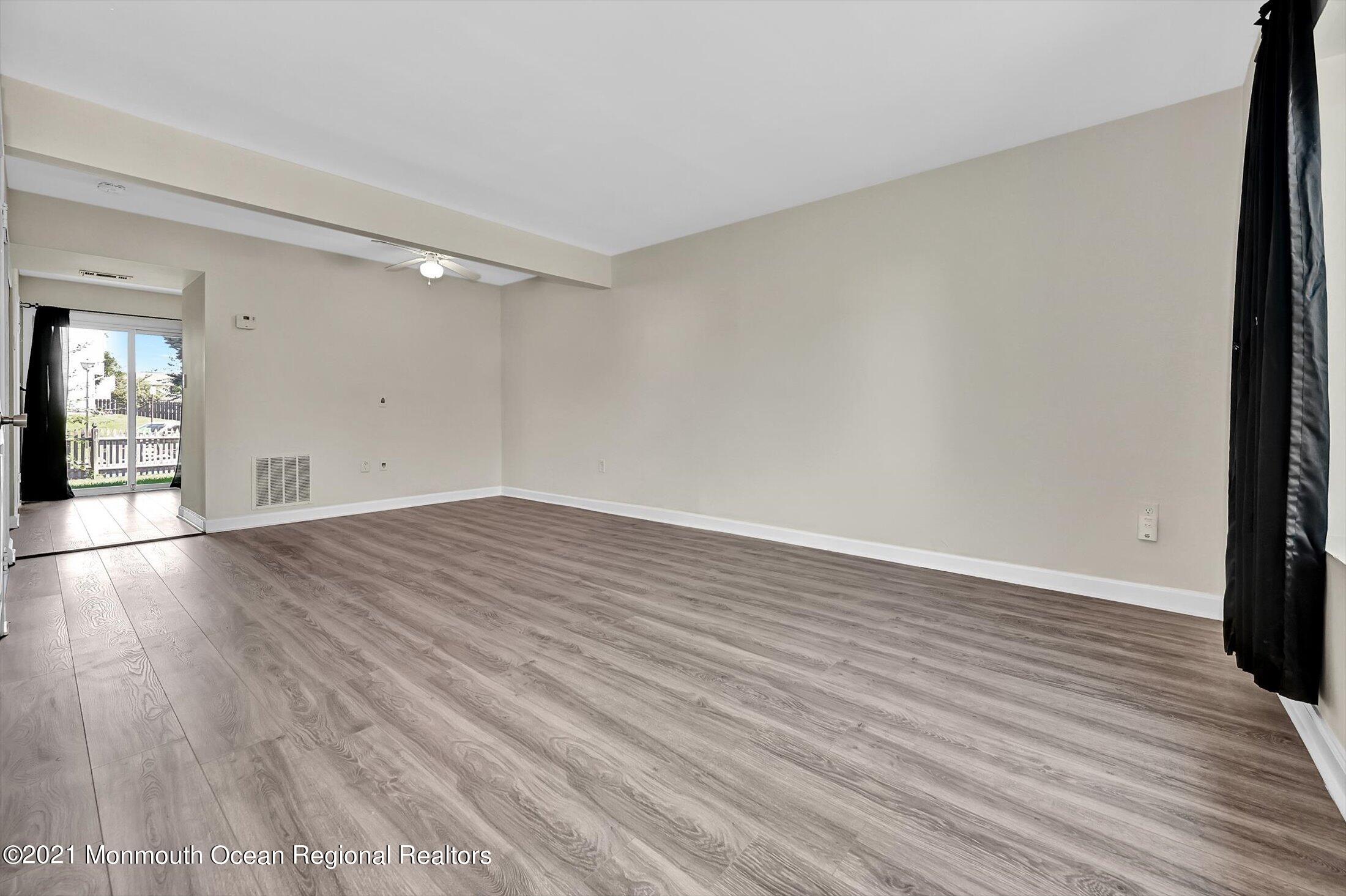 7 Creek Road Brick, NJ 08724 - Photo 2 of 14 a view of an empty room and wooden floor