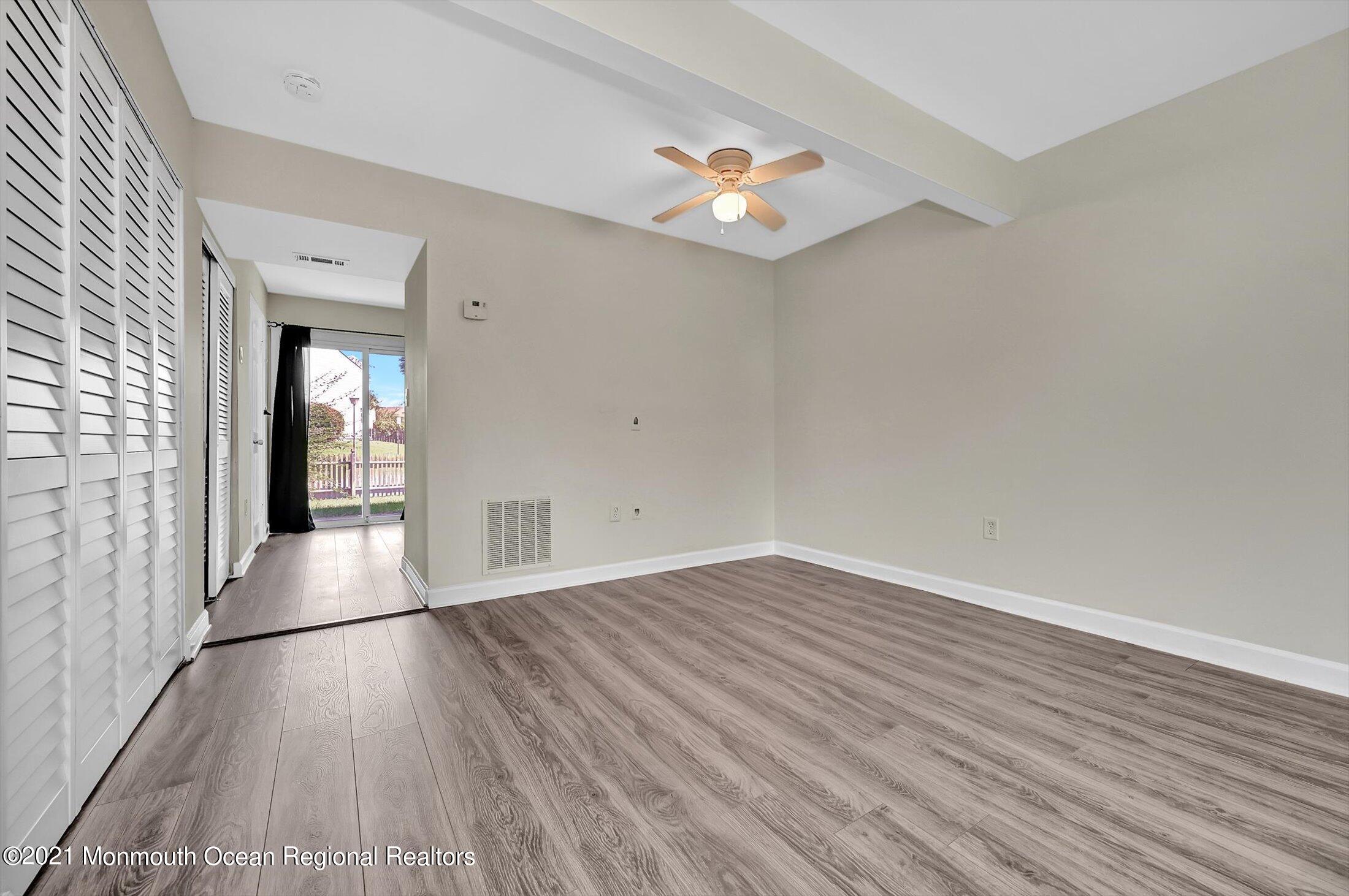 7 Creek Road Brick, NJ 08724 - Photo 5 of 14 wooden floor in an empty room with a window
