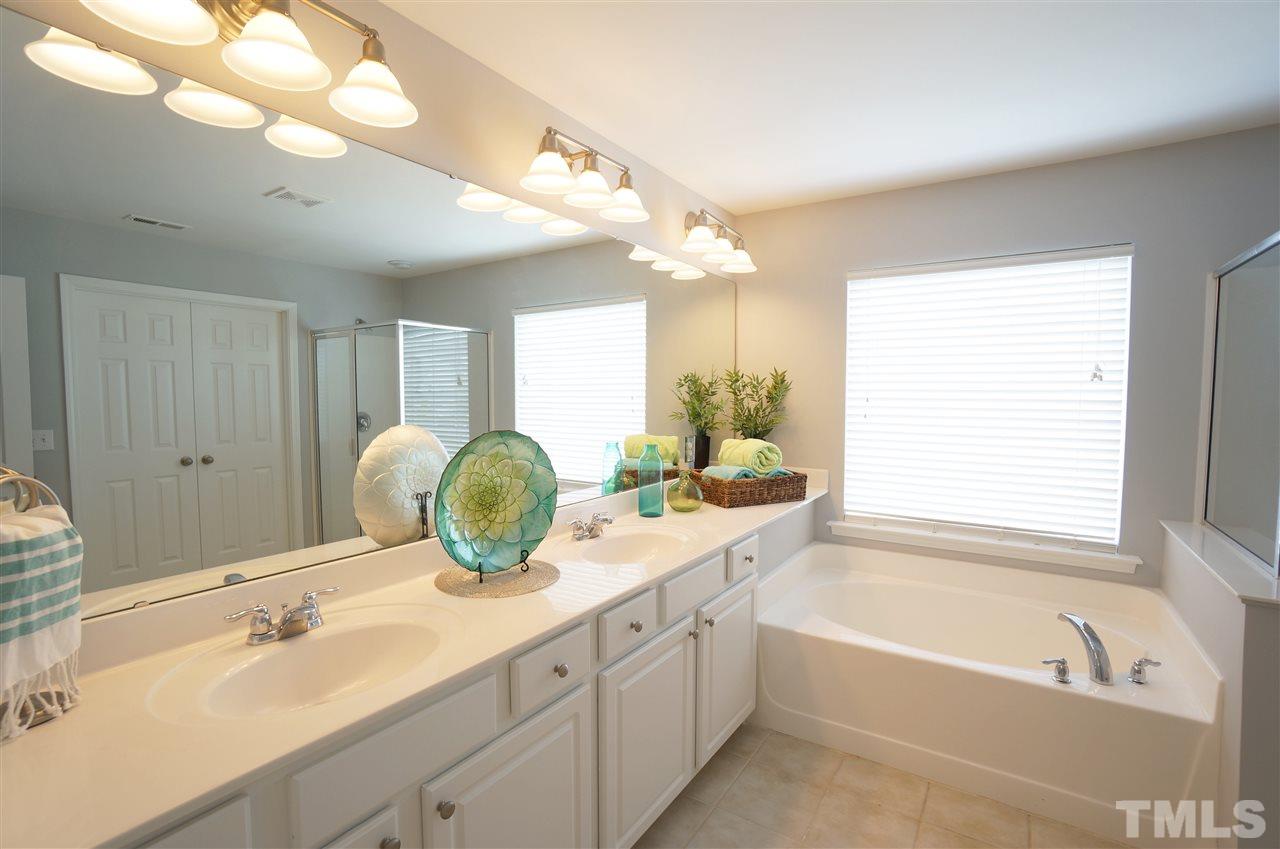 7730 San Gabriel Street Raleigh, NC 27613 - Photo 15 of 25 Master spa has large garden tub, separate shower and dual vanities with lots of counter space & storage.