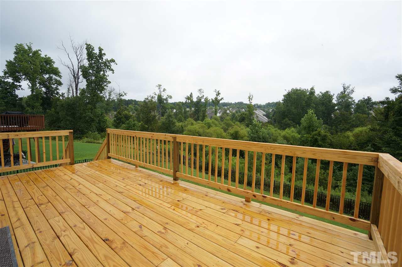 7730 San Gabriel Street Raleigh, NC 27613 - Photo 21 of 25 Newly built back deck looks out over the tree lined lot.