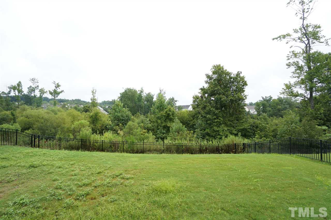 7730 San Gabriel Street Raleigh, NC 27613 - Photo 22 of 25 Fenced back yard backs to tree lined lot for added privacy & scenic beauty.