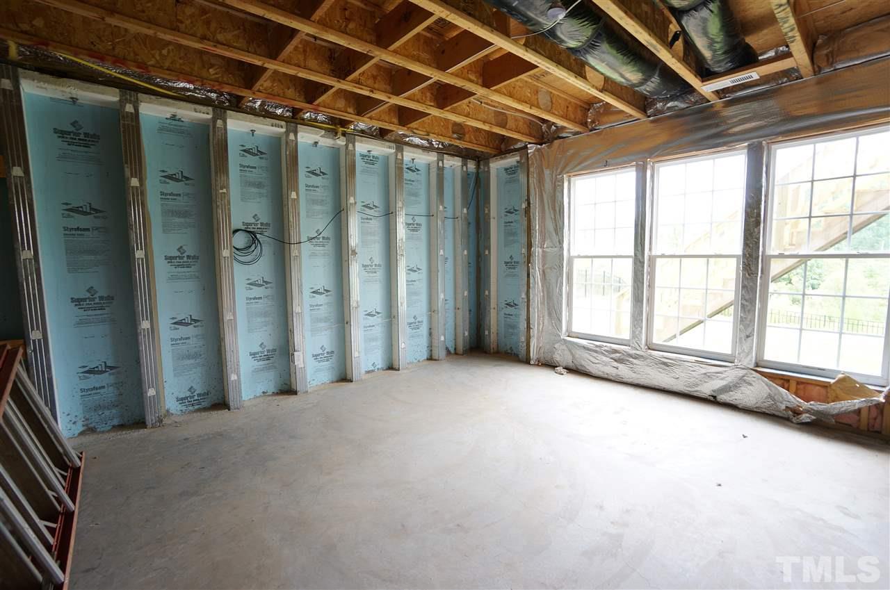 7730 San Gabriel Street Raleigh, NC 27613 - Photo 24 of 25 Basement has exterior entrance & lots of potential.