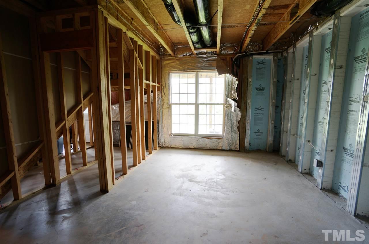 7730 San Gabriel Street Raleigh, NC 27613 - Photo 25 of 25 Basement has exterior entrance & lots of potential.