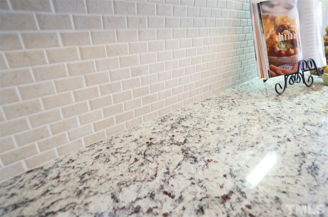 7730 San Gabriel Street Raleigh, NC 27613 - Photo 7 of 25 Granite counter tops have beautiful color, rich texture and style for days!