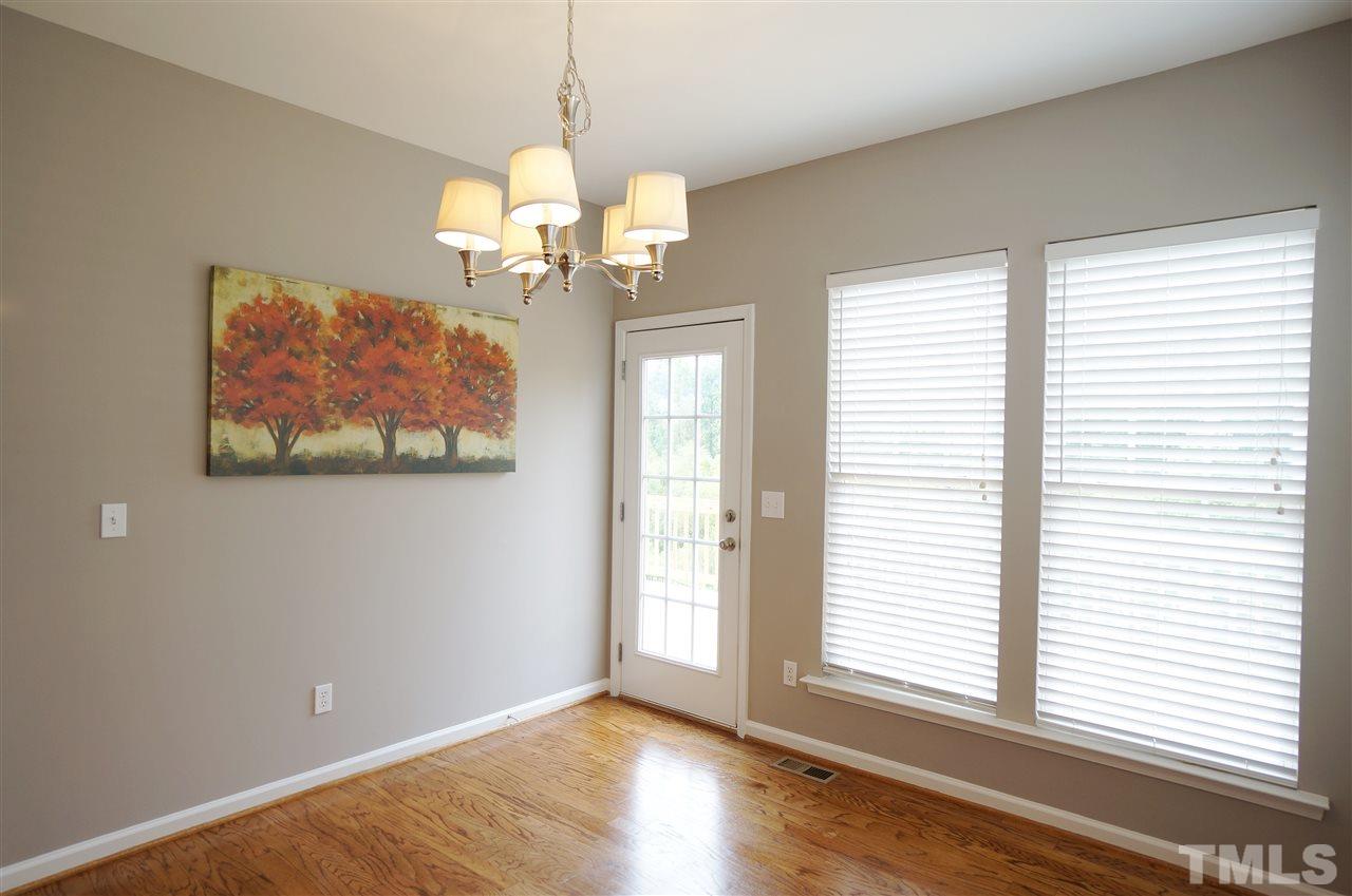 7730 San Gabriel Street Raleigh, NC 27613 - Photo 10 of 25 Breakfast area is bright, charming & has a lovely view of the tree lined lot.