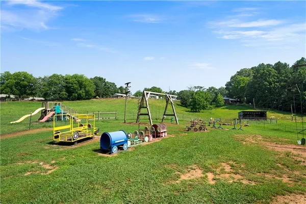 a swimming pool with trees in the background