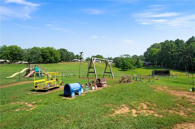 a swimming pool with trees in the background
