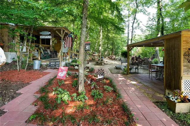 a outdoor space with chairs a couch and swing