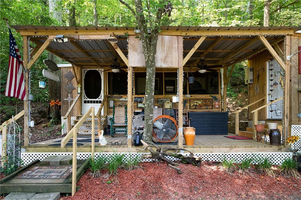 669 Nicklesville Road Northeast Resaca, GA 30735 - Photo 30 of 60 a view of a chairs and table in a patio