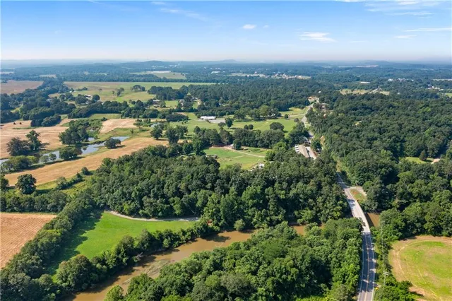 an aerial view of residential building and lake