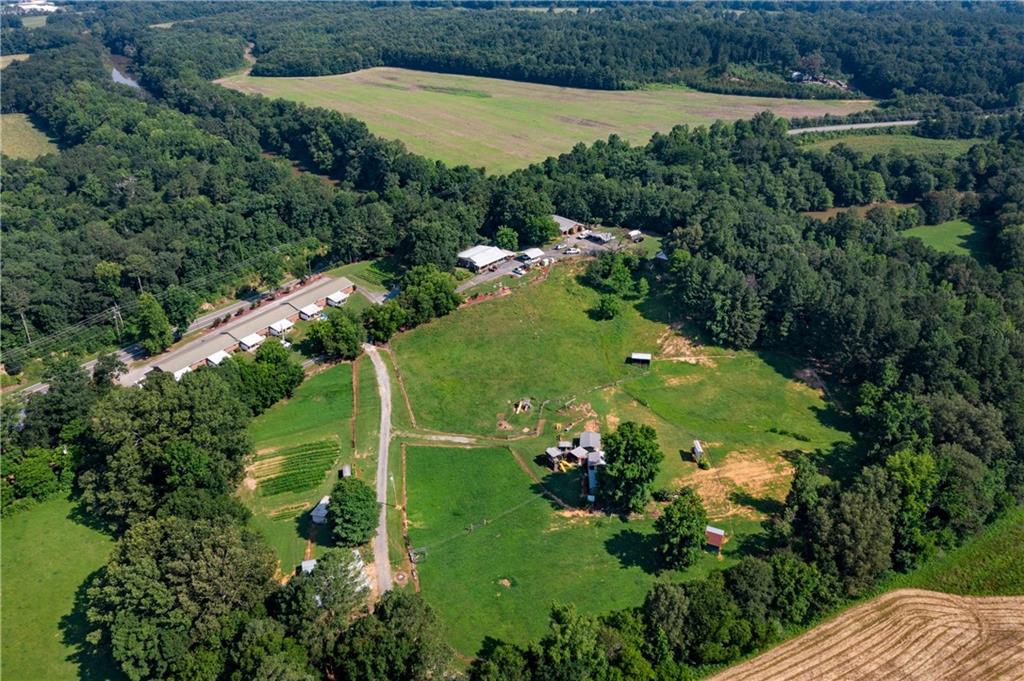 669 Nicklesville Road Northeast Resaca, GA 30735 - Photo 37 of 60 an aerial view of a residential houses with outdoor space and trees all around