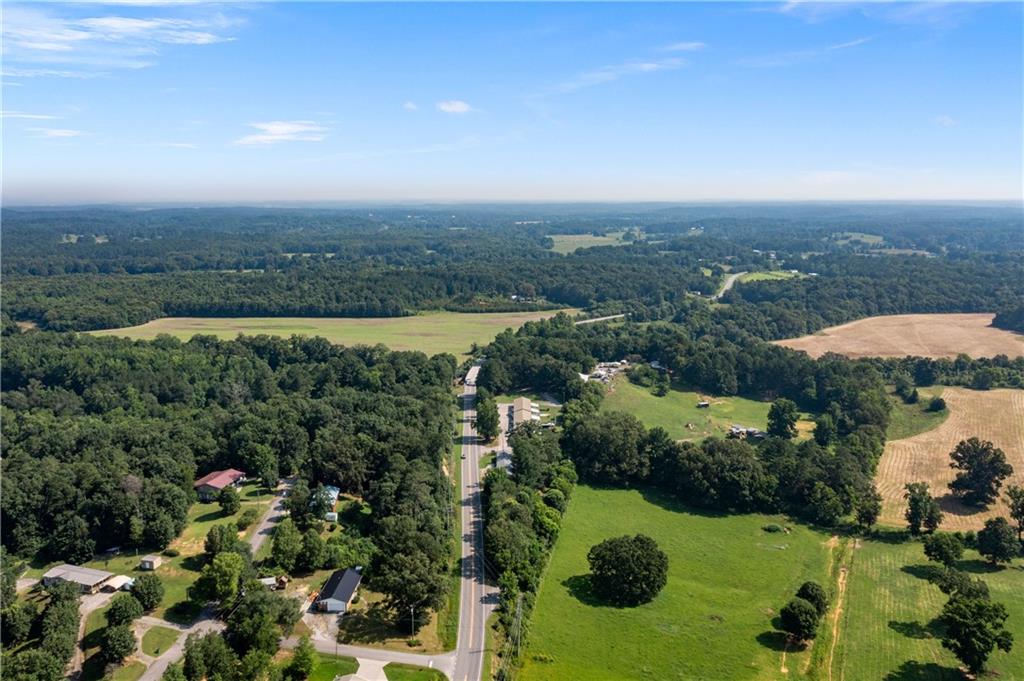 669 Nicklesville Road Northeast Resaca, GA 30735 - Photo 38 of 60 an aerial view of lake and residential houses with outdoor space