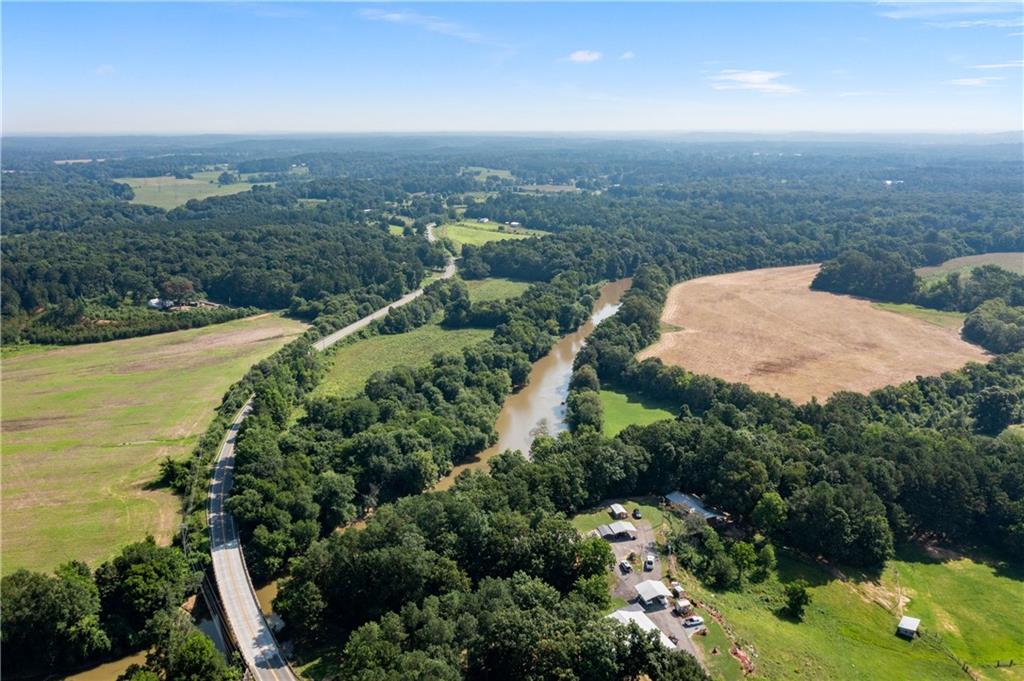 669 Nicklesville Road Northeast Resaca, GA 30735 - Photo 39 of 60 an aerial view of a house with a garden