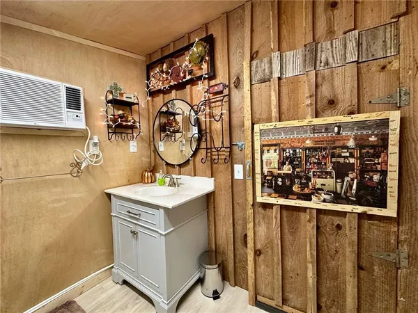 a kitchen with stainless steel appliances granite countertop a refrigerator a sink dishwasher a stove with wooden floors and cabinets