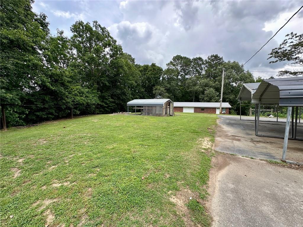 669 Nicklesville Road Northeast Resaca, GA 30735 - Photo 46 of 60 a view of a swimming pool with a patio