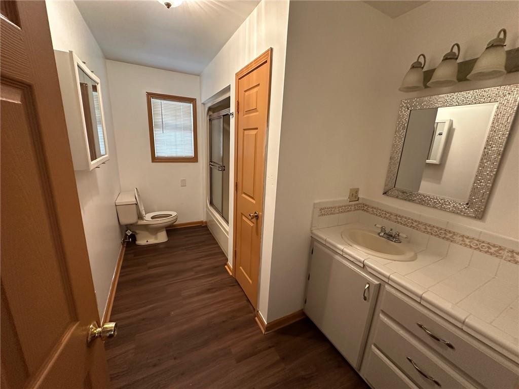 669 Nicklesville Road Northeast Resaca, GA 30735 - Photo 56 of 60 a bathroom with a sink a toilet and a mirror
