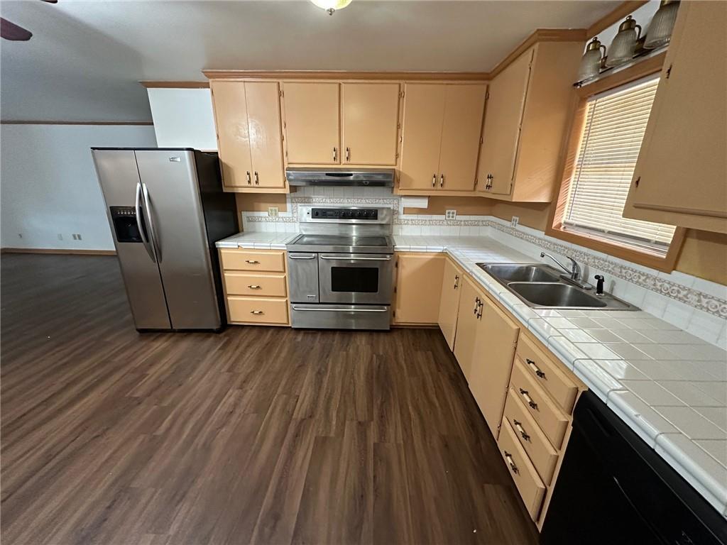 669 Nicklesville Road Northeast Resaca, GA 30735 - Photo 58 of 60 a kitchen with a stove a sink and a refrigerator