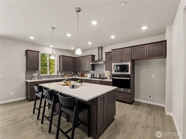a kitchen with a table and chairs in it