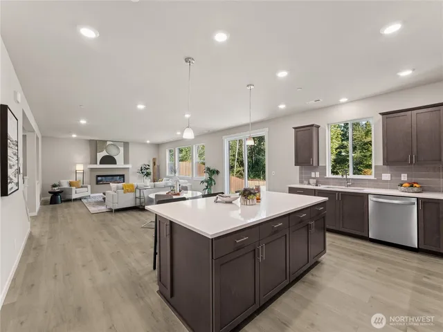 a kitchen with sink stove and cabinets