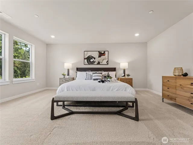 a bedroom with a bed and window