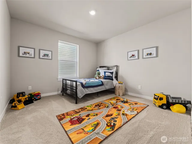 a bedroom with furniture and a wooden floor