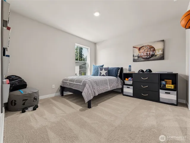 a bedroom with a bed and a couch